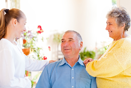 older couple smiling at their carer