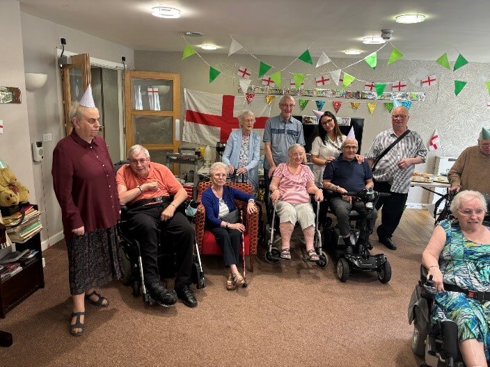 A group of carers and service users in a room